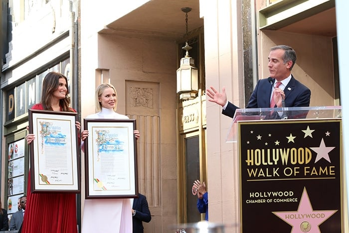 Los Angeles Mayor Eric Garcetti presents certificates to Idina Menzel and Kristen Bell 