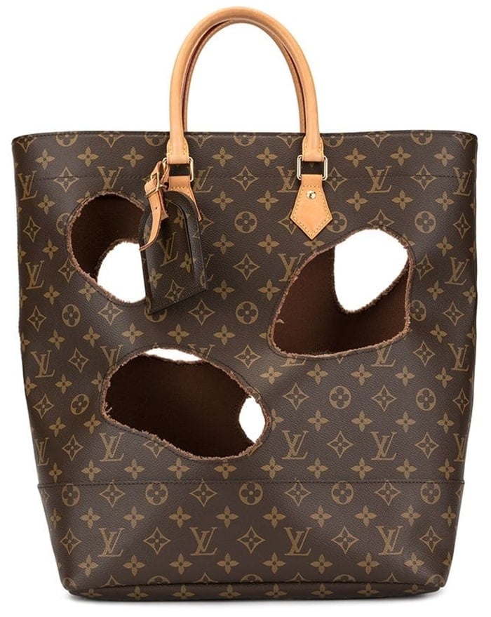 This dark brown and beige leather tote from Louis Vuitton features a monogram pattern, gold-tone hardware, round top handles, an internal logo patch, a hanging luggage tag, a drawstring closure, and a removable lining