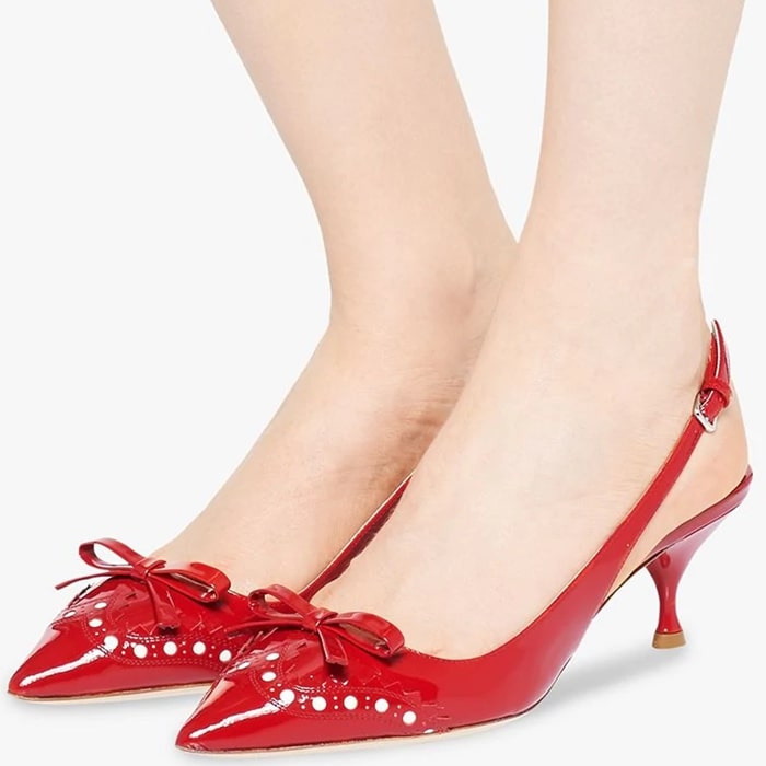 Miu Miu has been synonymous with luxury and forward-thinking design and has a creative and innovative take on femininity as seen in these vibrant red patent leather brogue detail slingback pumps