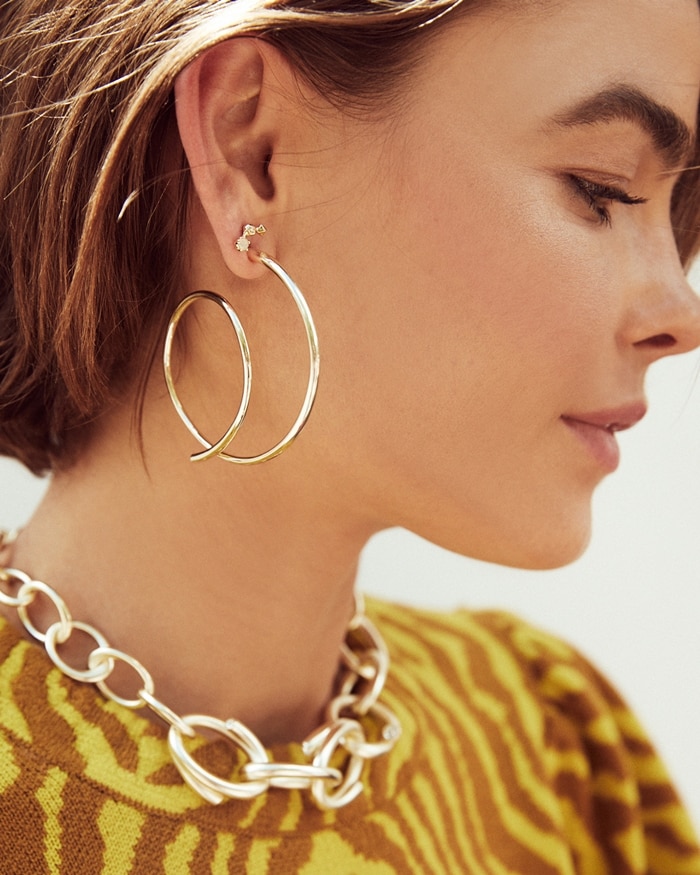 Pyramid crystals put the punctuation mark at the end of these artsy loopty loop earrings