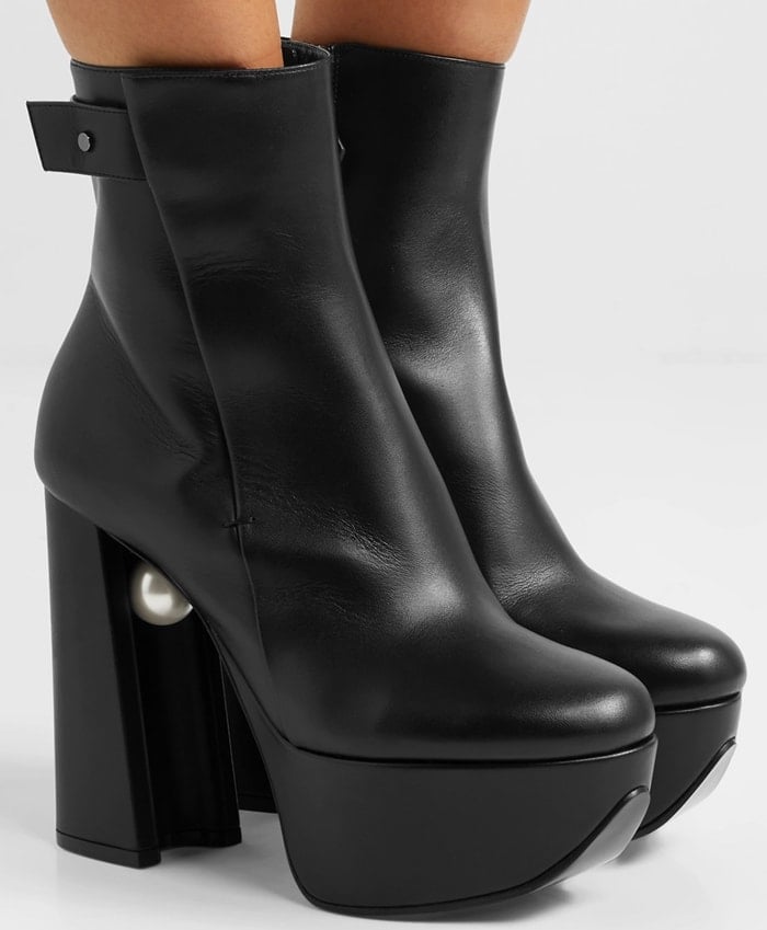 Nicholas Kirkwood reimagines its Miri boots with retro proportions in this black pair that are set on high platforms partnered with sculptural block heels