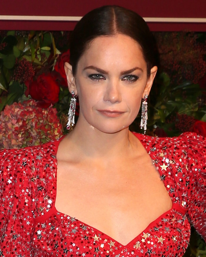 Ruth Wilson looks fierce with dark eyeliner and center-parted updo