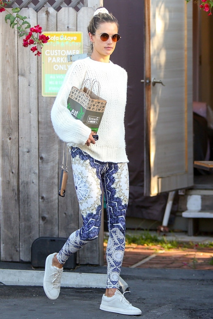 Alessandra Ambrosio rocks an Ellie Mae Studios Esmeralda sweater and Garrett Leight's brown tortoiseshell acetate Sanborn sunglasses that are named after the namesake street in Los Angeles