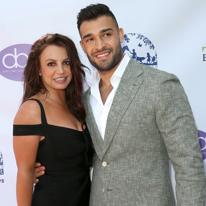 Britney Spears radiates elegance in a sleek black House of CB dress while supporting Sam Asghari, her personal trainer and partner