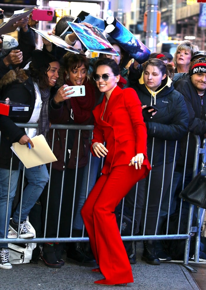 Daisy Ridley stuns in a red suit while signing autographs at Good Morning America