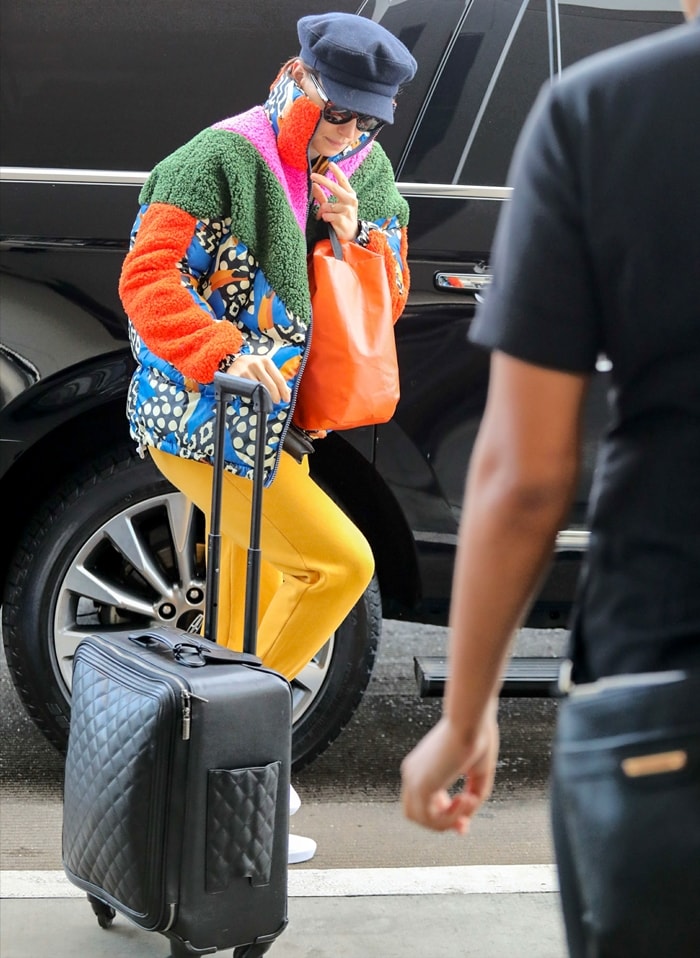 Daisy Ridley rolling a Chanel suitcase at Los Angeles International Airport