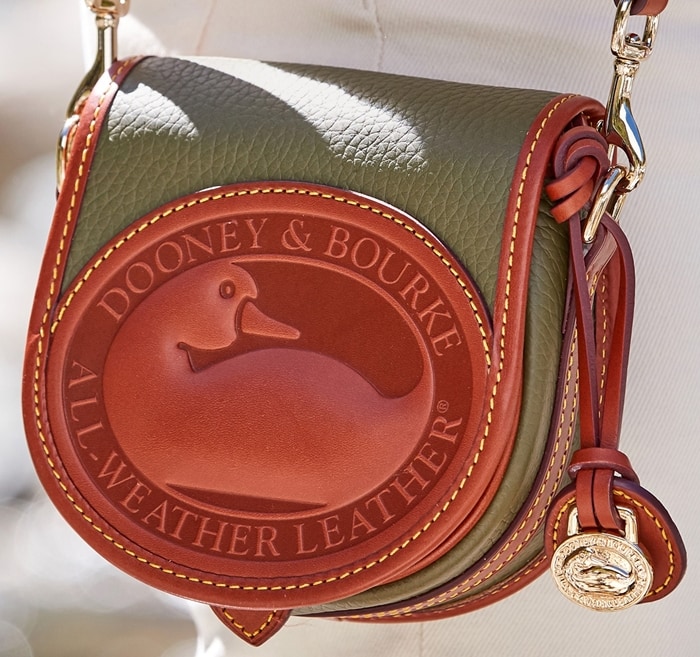 Dooney & Bourke handbags are finished with neat topstitching and polished gold hardware