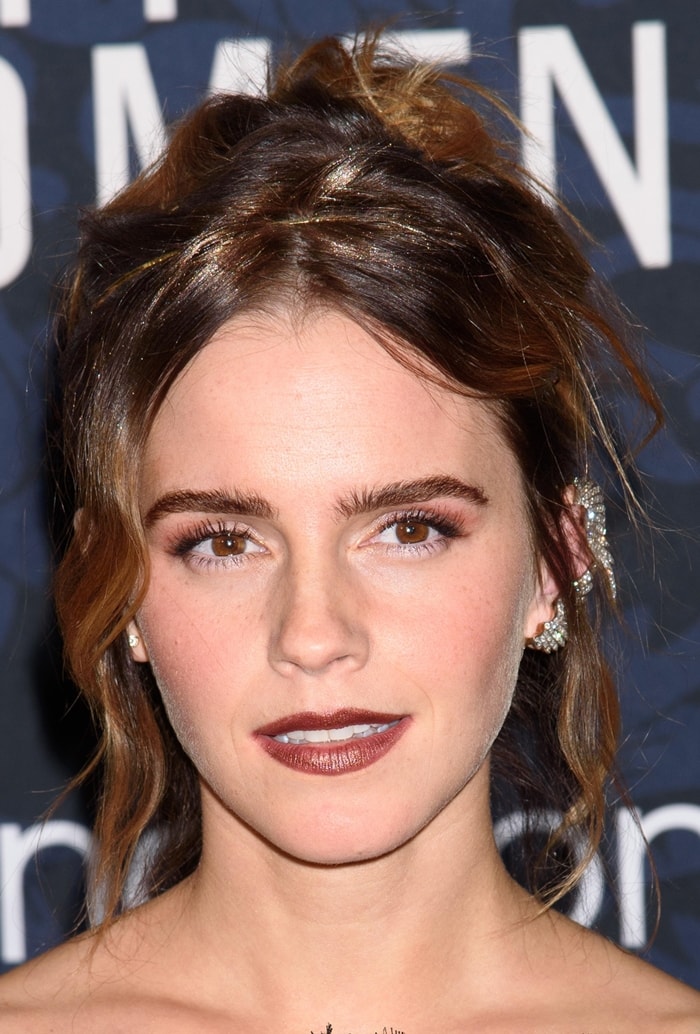 Emma Watson with a tousled hairstyle to show off her Fred Leighton diamond wing ear cuffs