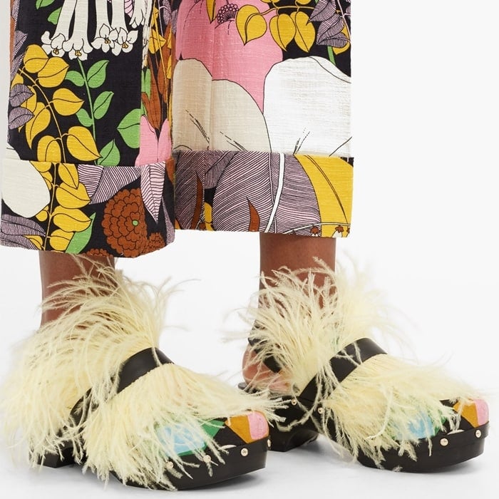 La DoubleJ evokes a flamboyant mood with the whisper-weight yellow feathers adorning these black Jean clogs, created in collaboration with Fabrizio Viti