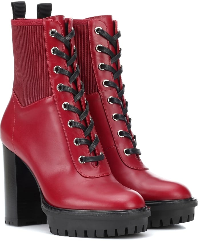 The lace-up pair has a chunky stacked heel in black and a tough combat boot silhouette