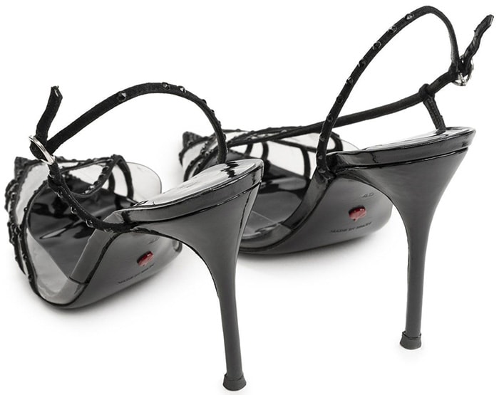 Juan Vidal takes on the slingback in strips of black fabric that form a ladylike heart at the top of the foot