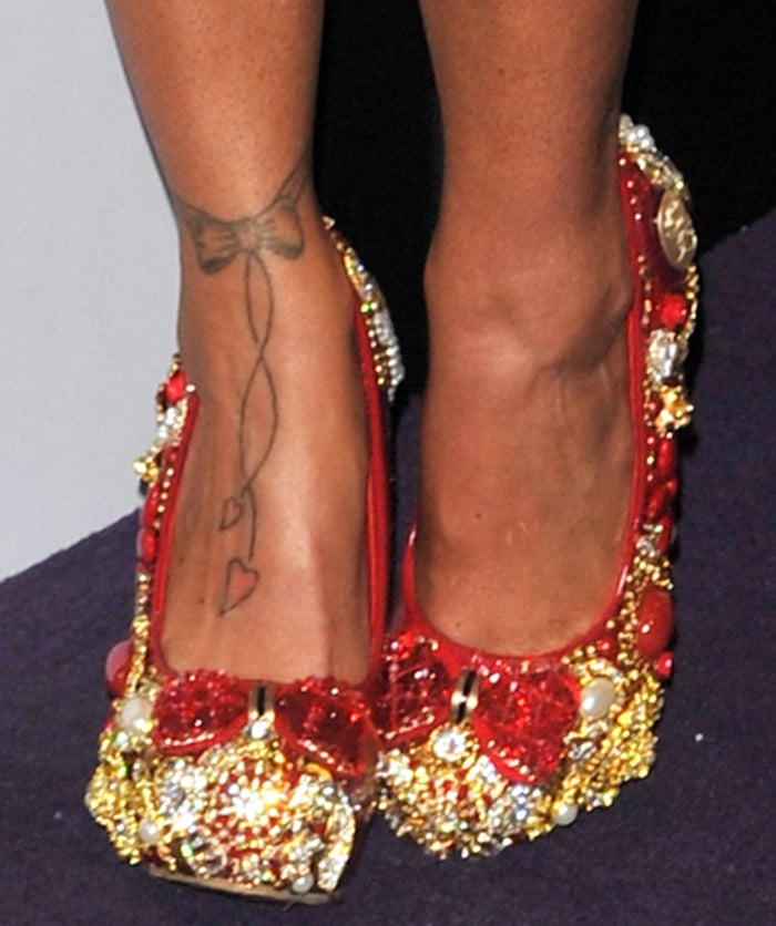 Katie Price has a tattoo of a bow with two hearts on her right foot