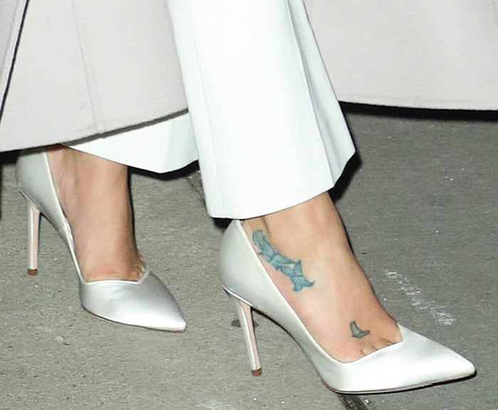 Lea Michele shows off her foot tattoos in Stuart Weitzman pumps