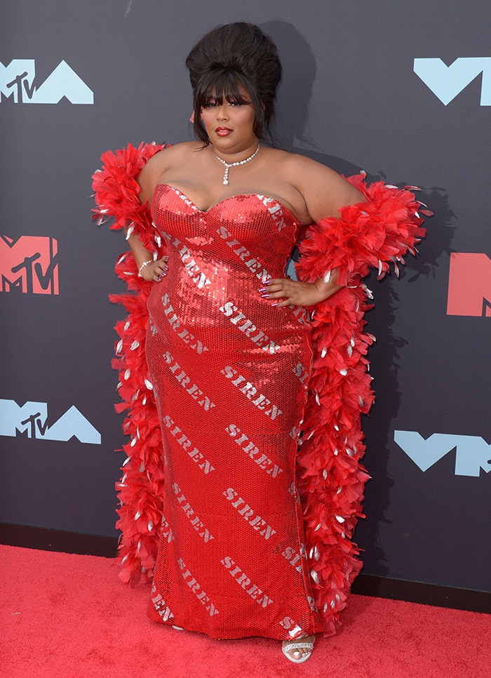 Lizzo in a custom red Moschino by Jeremy Scott sequin gown at the 2019 MTV VMAs on August 26, 2019