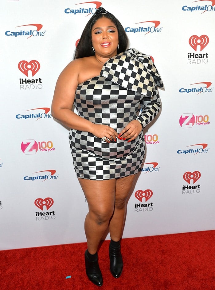 Lizzo wears a silver and black checkered dress at iHeartRadio's Z100 Jingle Ball 2019 at Madison Square Garden in New York City on December 13, 2019
