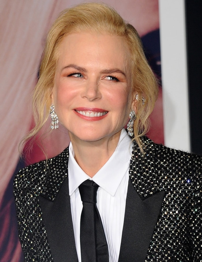 Nicole Kidman wore a black shimmery blazer over a white button-down top