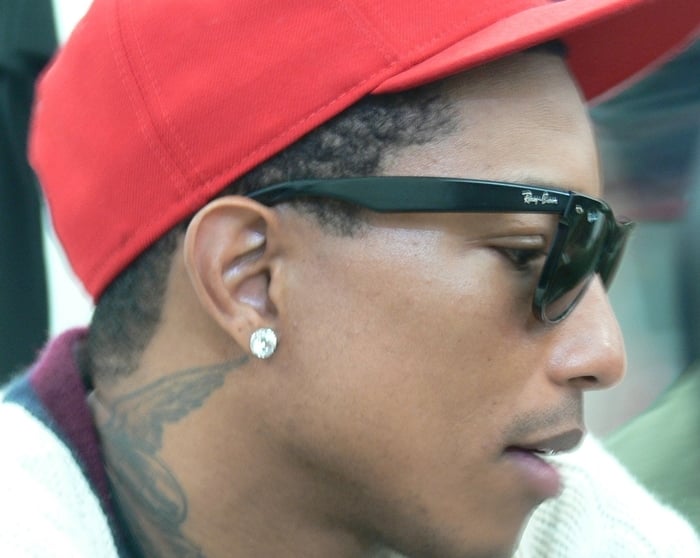 Pharrell Williams wears genuine Ray-Ban sunglasses with unmistakable frames featuring the engraved logo