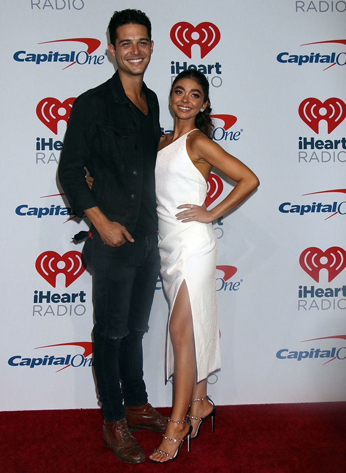 Sarah Hyland looks radiant in Manning Cartell dress and Sophia Webster heels while posing with Wells Adams