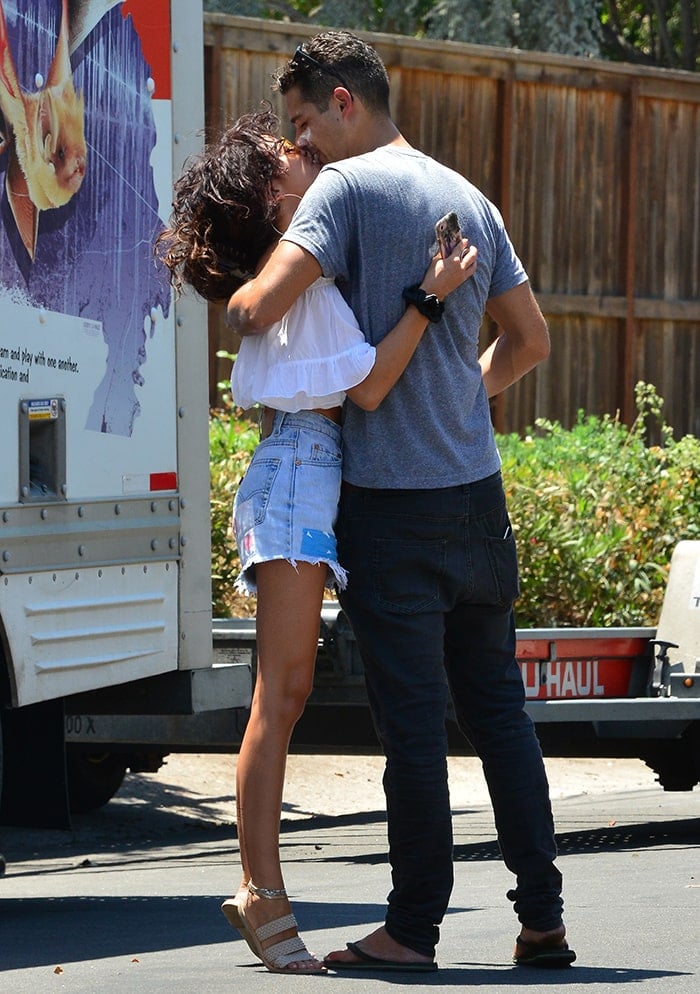 Sarah Hyland welcomes Wells Adams with a kiss after moving in together on August 3, 2018