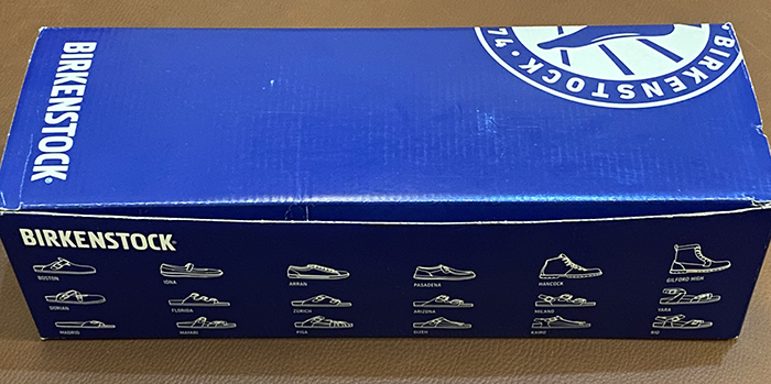 The front side of a Birkenstock box shows illustration of different Birk models