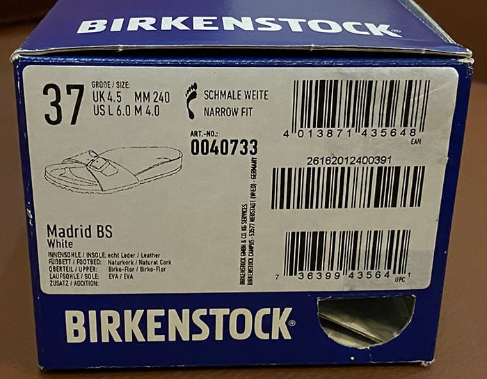 The opposite side of the box has a sticker label that contains information about the shoes