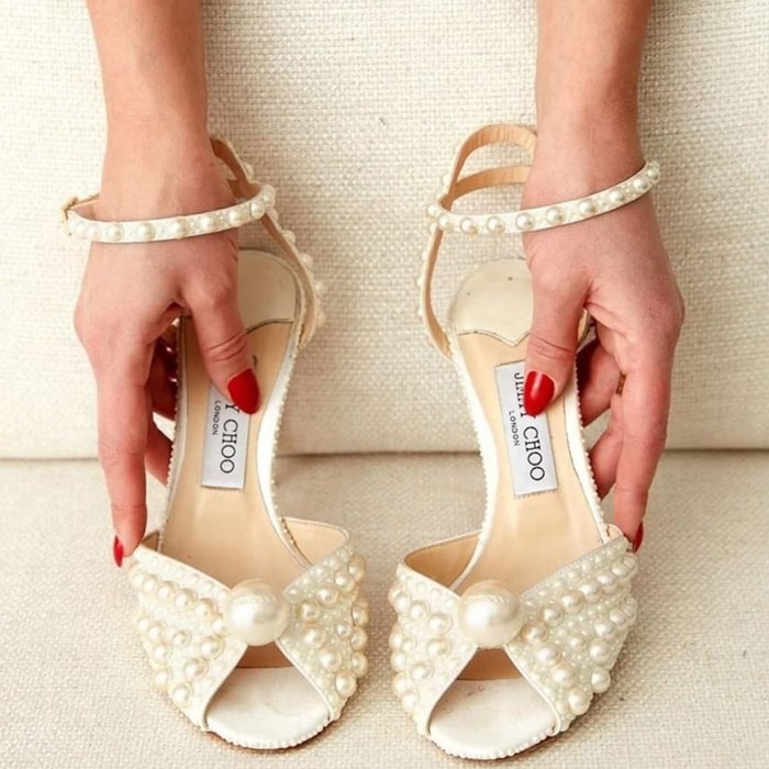 Sacora is a vintage inspired sandal crafted in sophisticated white satin with all over pearls