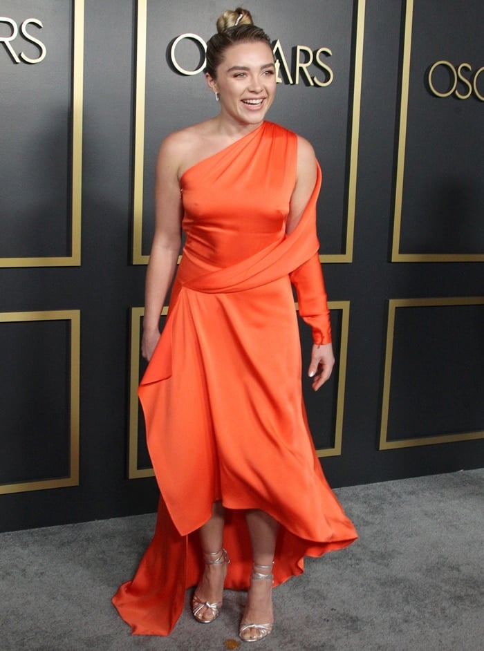 Florence Pugh went braless in a tangerine-hue Monse dress