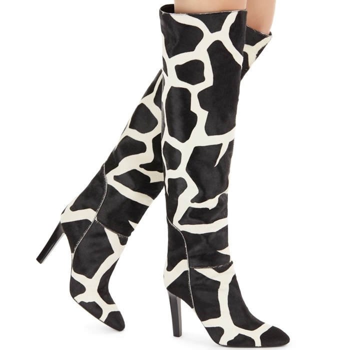 These high-top, giraffe print, natural pony boots feature high heels, and are set on a leather sole with logo