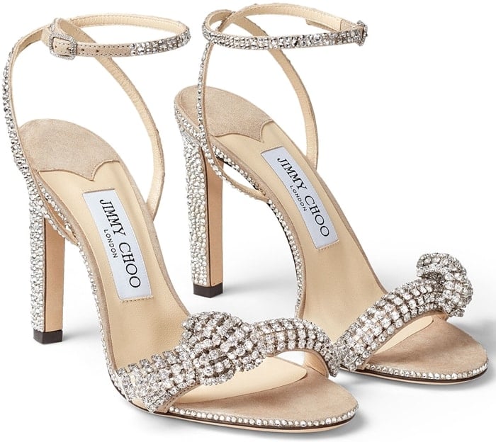 Topped with knotted crystal-encrusted embellishment and allover sparkling beads, these suede sandals exude high-glam elegance