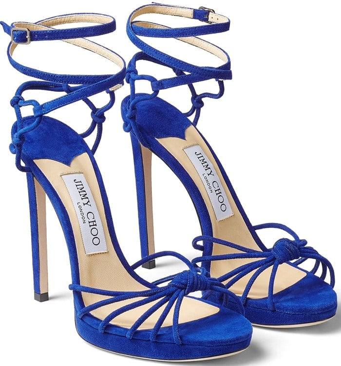 These cobalt blue sandals are set on a slender stiletto heel and platform, and designed with a knotted strappy front that elegantly encases your feet