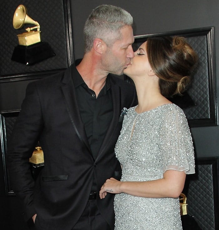 Sean "Sticks" Larkin kisses his girlfriend Lana Del Rey