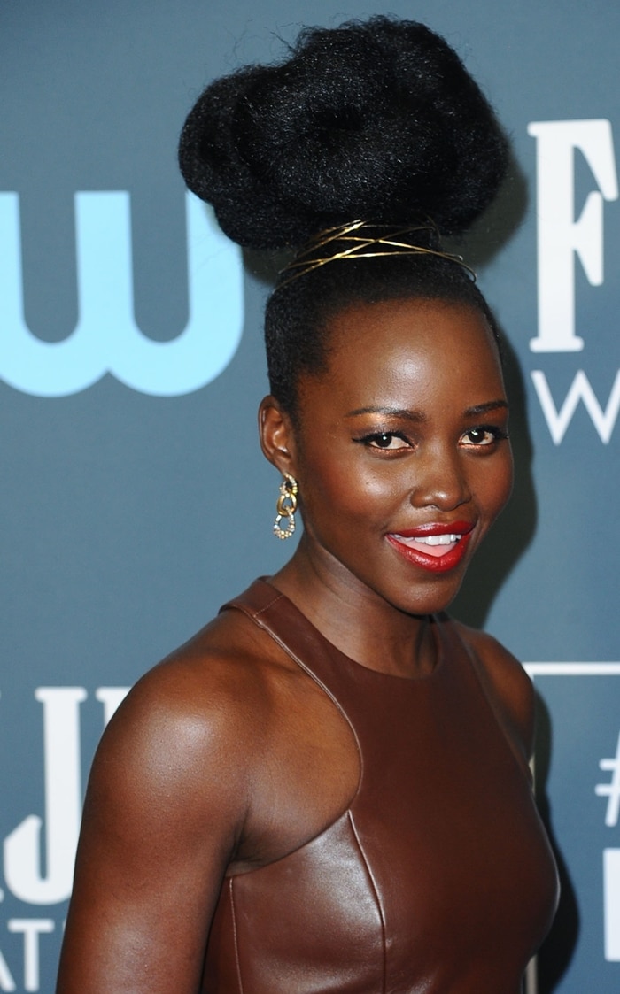 Lupita Nyong'o turned heads with a sculptural updo styled by international award-winning celebrity hairstylist Vernon François, adding regal flair to her look