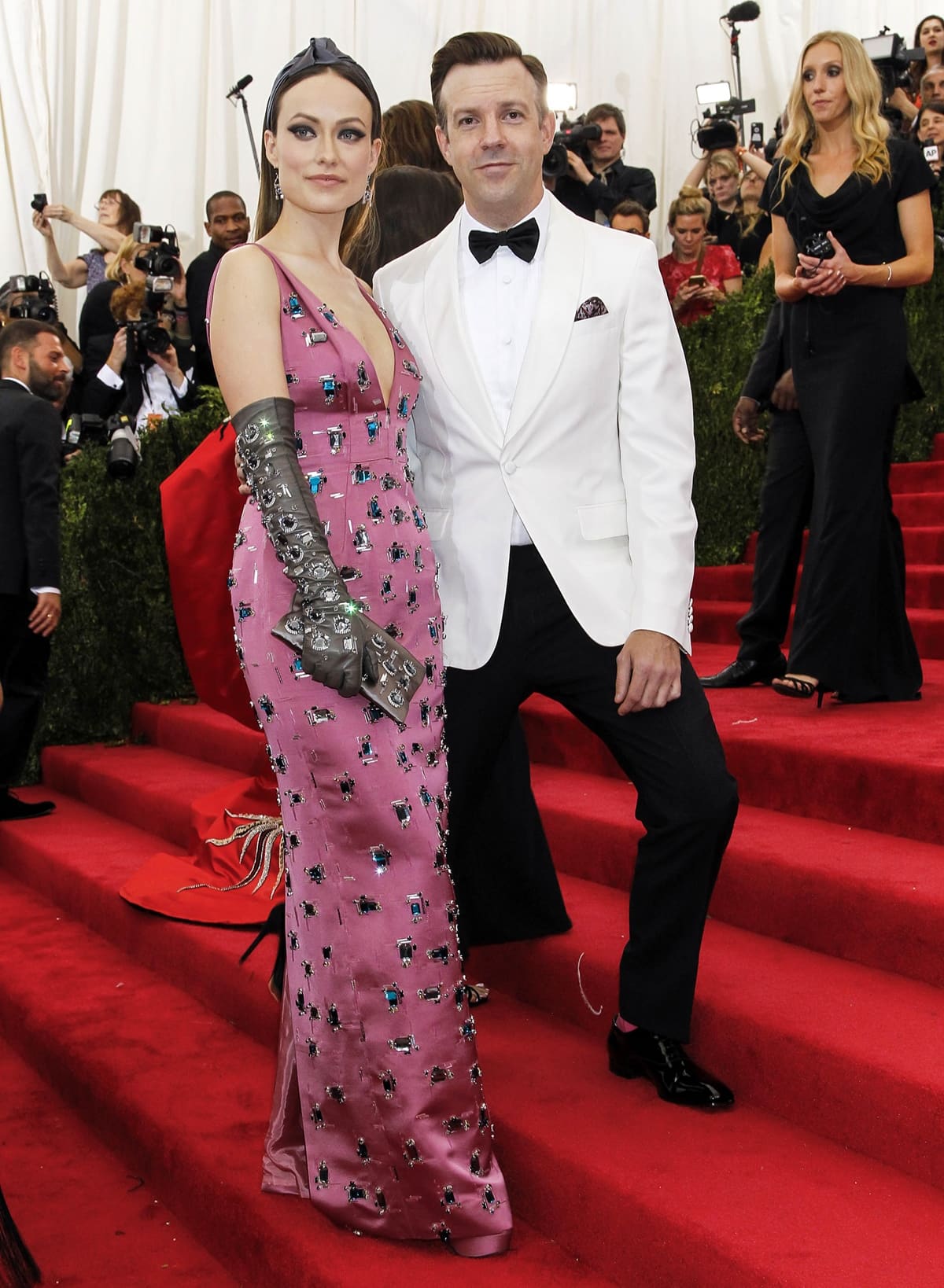 Olivia Wilde, wearing a pink sleeveless Prada beaded dress and Solange Azagury-Partridge earrings, and Jason Sudeikis in a Prada suit at the 'China: Through The Looking Glass' Costume Institute Benefit Gala