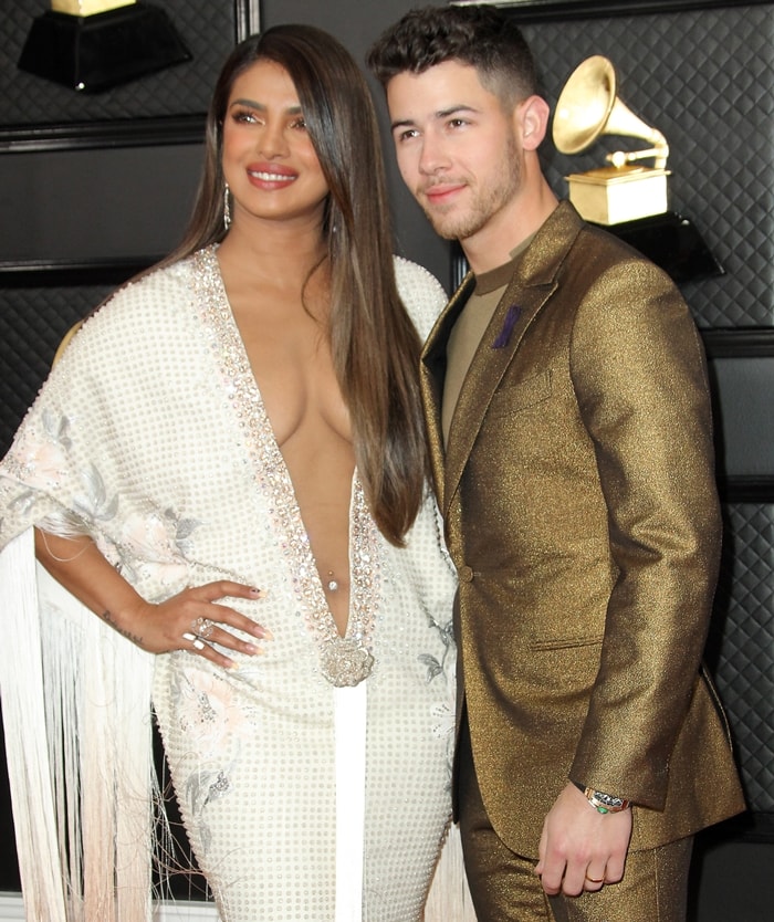 Nick Jonas rocked an Ermenegildo Zegna XXX tuxedo while Priyanka Chopra flaunted her belly button ring