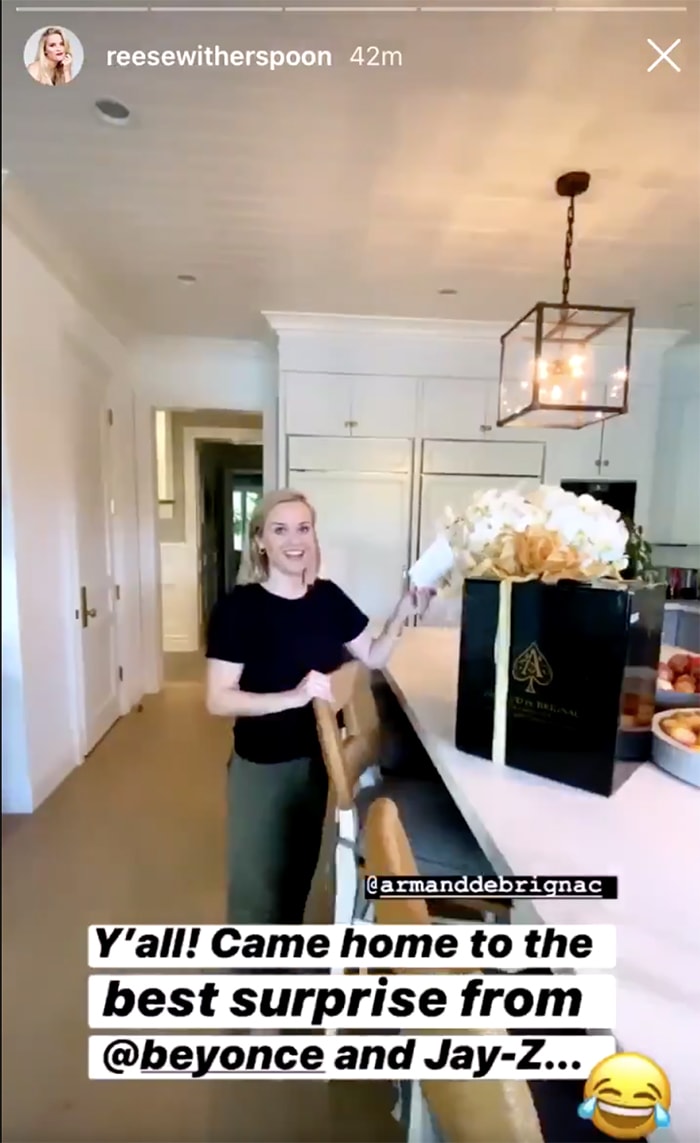 Reese Witherspoon receives a case of Armand de Brignac champagne from Beyonce and Jay-Z