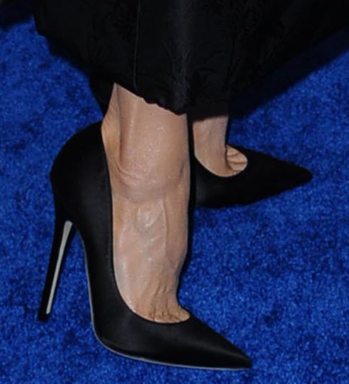 Renée Zellweger teams her black dress with classic black Jimmy Choo pumps