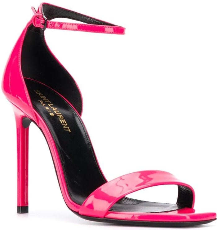 Neon pink patent leather Amber open toe sandals from Saint Laurent featuring an ankle strap with a side buckle fastening, a high stiletto heel, a branded insole, a single toe strap and an open square-shape toe