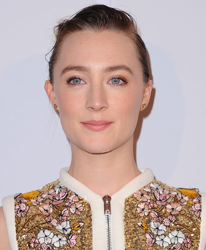 Saoirse Ronan wears a chic bun with soft pink makeup