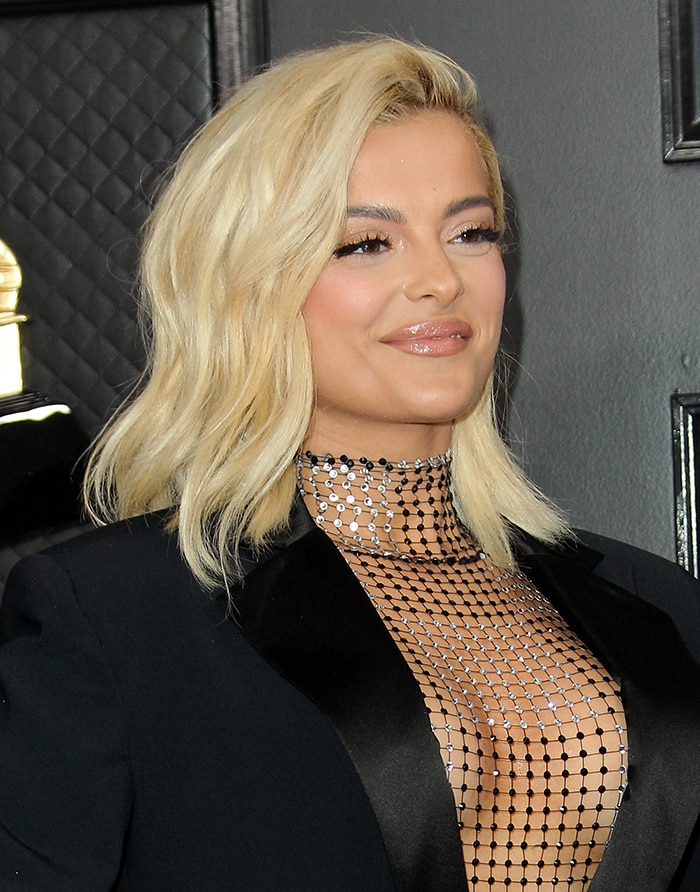 Bebe Rexha wears soft pink makeup with side-swept hairstyle