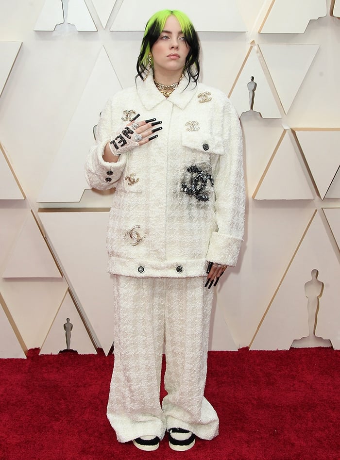 Billie Eilish sports a messy but chic updo and soft makeup-look