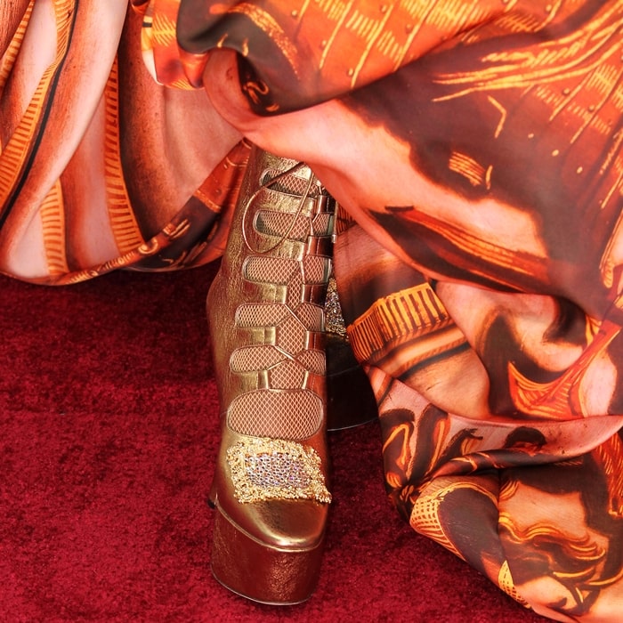Billy Porter rocked fishnets with gold crystal-embellished Jimmy Choo platform heels