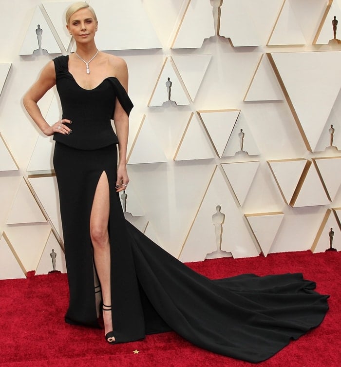 Charlize Theron wearing a black Christian Dior Haute Couture gown with Tiffany & Co jewelry