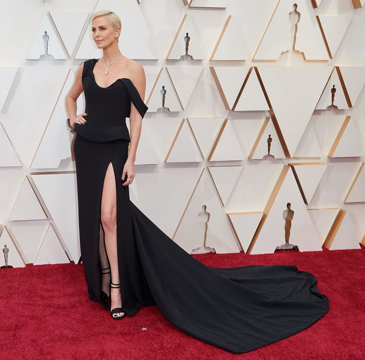 Charlize Theron commands the 92nd Academy Awards red carpet in a sculptural black Christian Dior Haute Couture gown accented with dazzling Tiffany & Co. jewelry