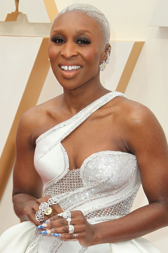 Cynthia Erivo wears her pearl blonde buzzcut with smokey eyeshadow with nude lipstick