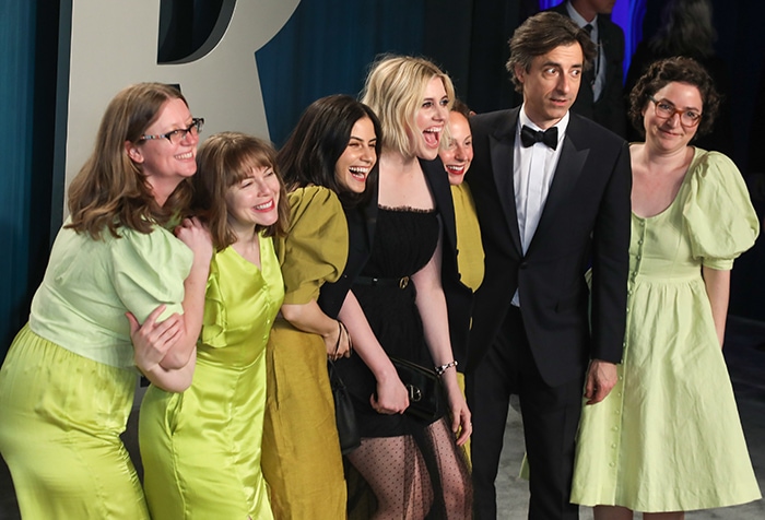 Greta Gerwig with her partner Noah Baumbach and her friends dressed in coordinating green outfit at the Vanity Fair Oscar Party