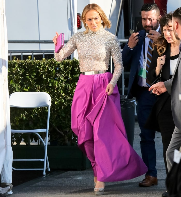 Jennifer Lopez dazzled in a sparkling Valentino sequin turtleneck paired with a bold magenta skirt and silver Casadei platform heels at the 2020 Spirit Awards