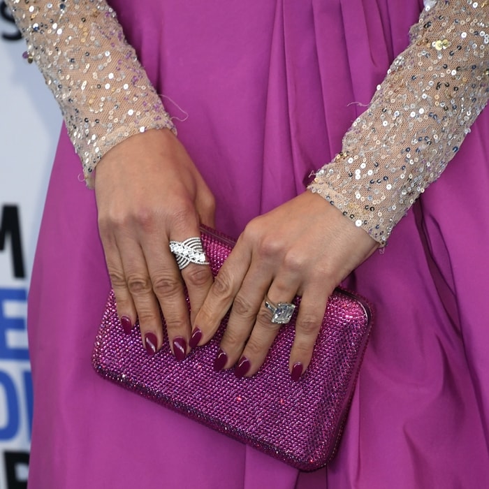 Jennifer Lopez toting an ultra-glam hinged Judith Leiber clutch encrusted with crystals