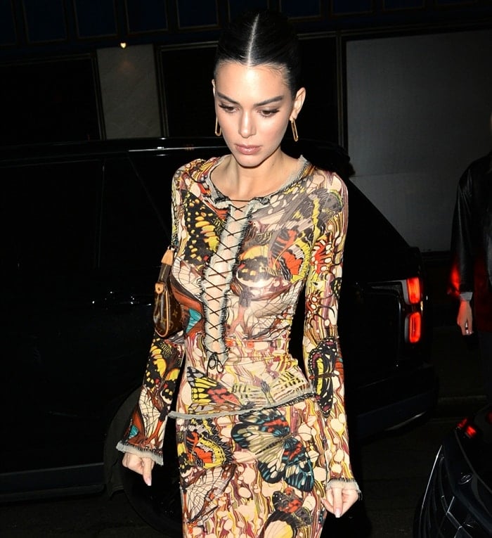 Kendall Jenner wearing a vintage butterfly sheer lace-up top with a matching maxi skirt by Jean Paul Gaultier