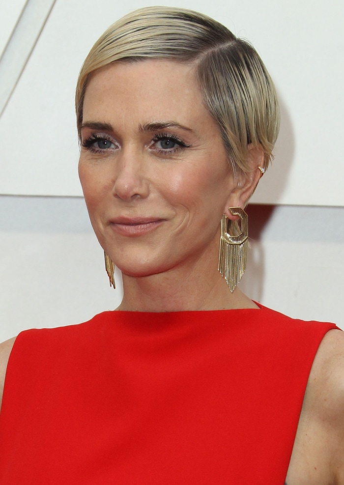 Kristen Wiig in a '60s glam look with side-parted pixie hairstyle