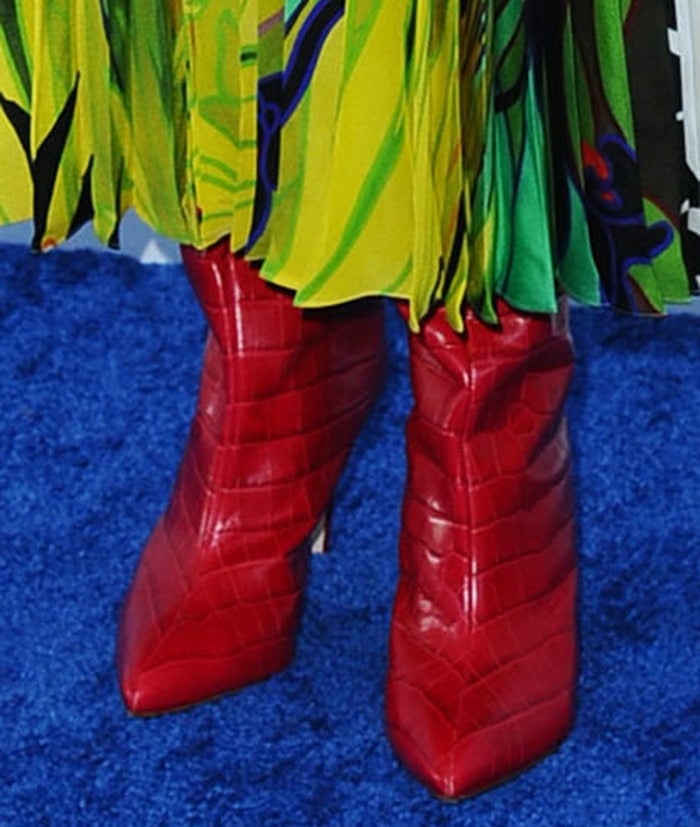 Laura Dern teams her dress with a pair of red boots from Schutz